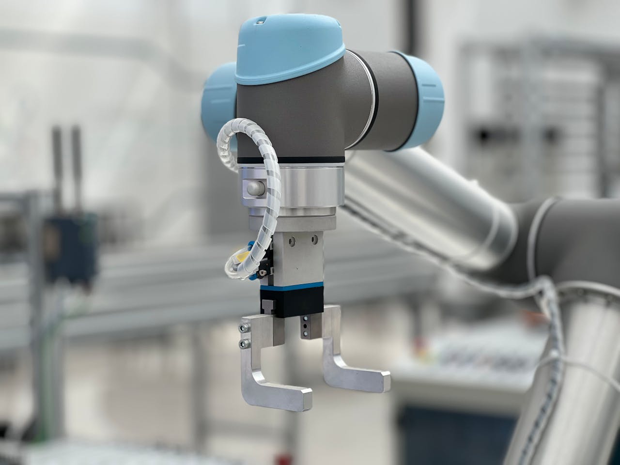 A collaborative robot arm and gripper in a laboratory